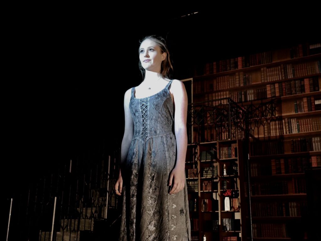 actor onstage at the Warwick Ancient Drama Festival performance of Medea