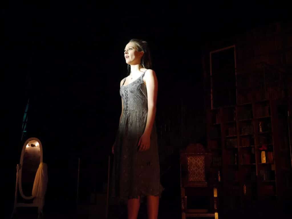 actor onstage at the Warwick Ancient Drama Festival performance of Medea