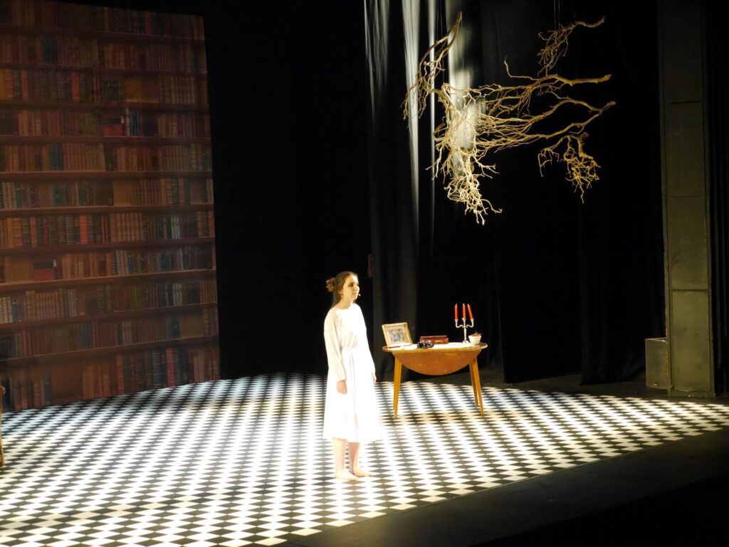 actor onstage at the Warwick Ancient Drama Festival performance of Medea