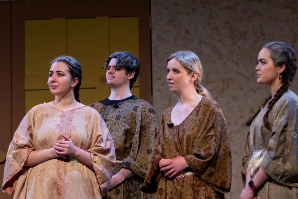 still of 4 actors on stage at Warwick Ancient Drama Festival performing in Aeschylus' The Persians