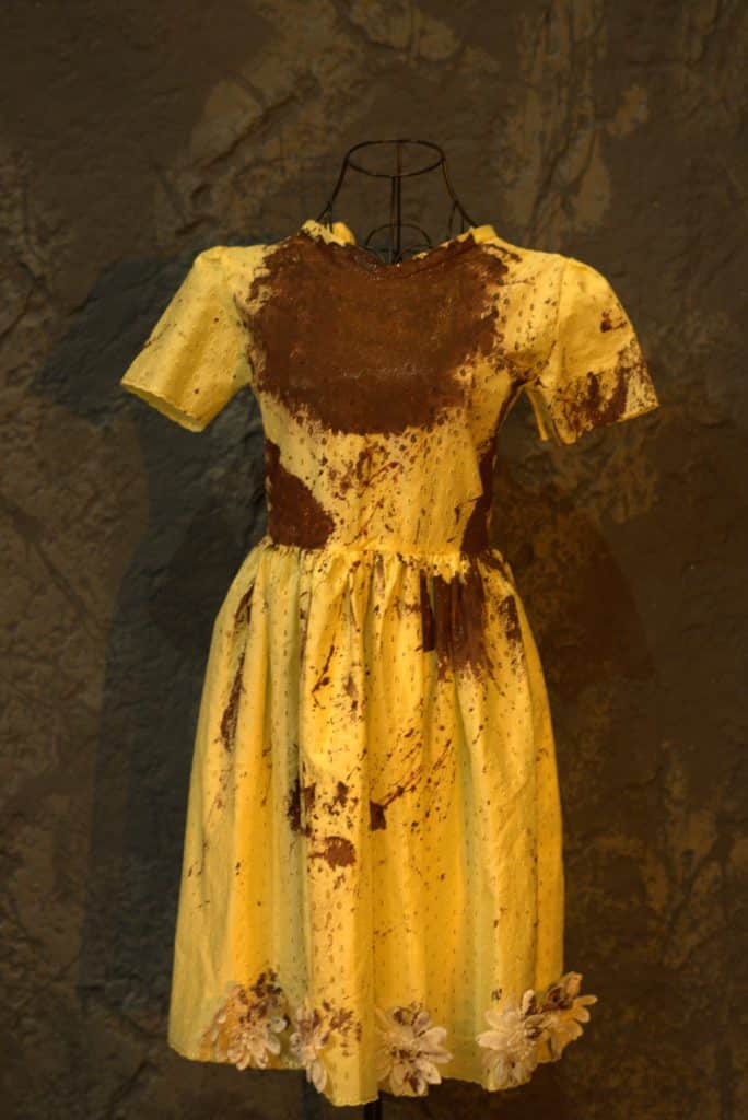 Iphigenia's yellow sacrificial dress, covered in blood
