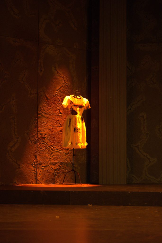 Iphigenia's yellow sacrificial dress, covered in blood