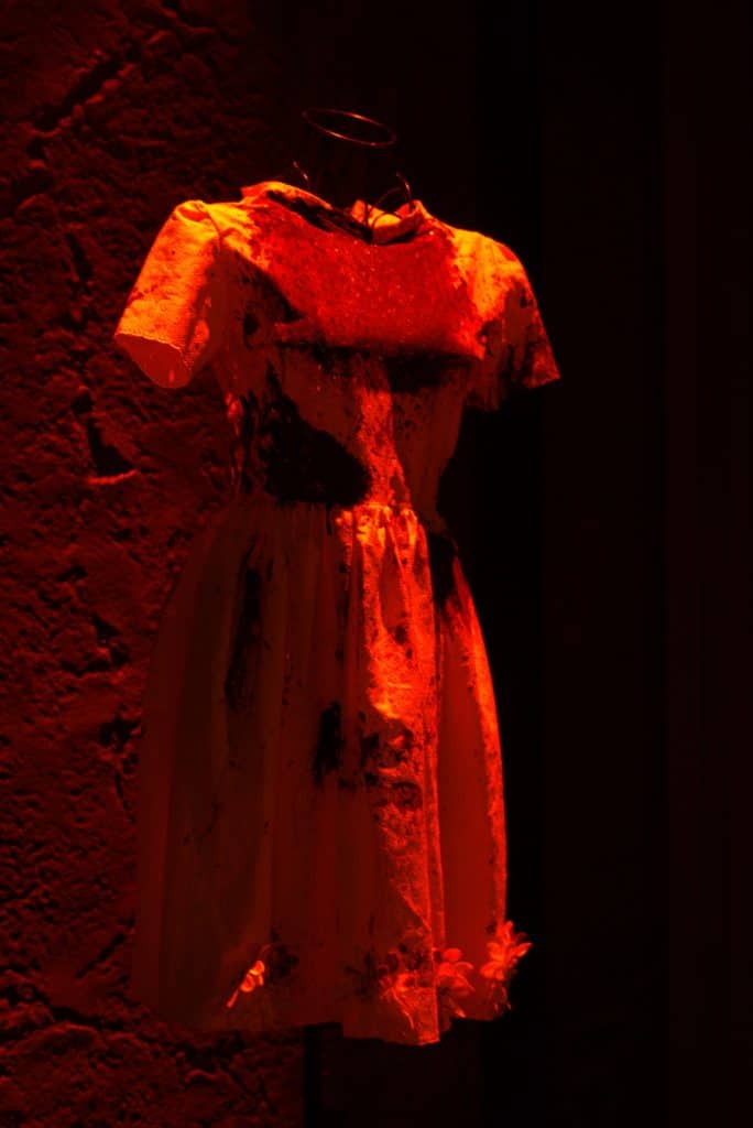 Iphigenia's yellow sacrificial dress, covered in blood