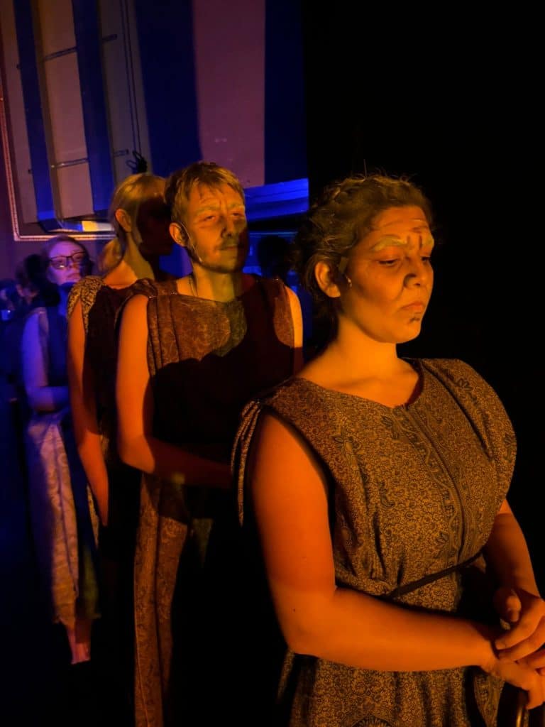 Actors waiting in the wings to go out on stage